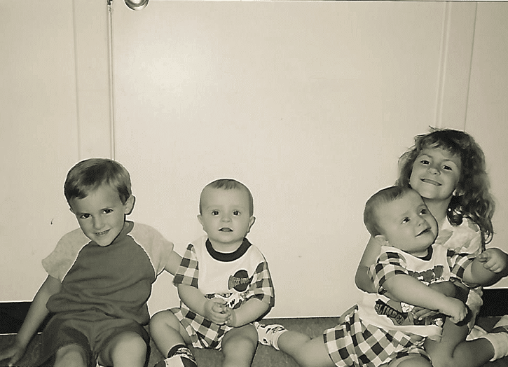 old photo of twin babies and two kids raise twins