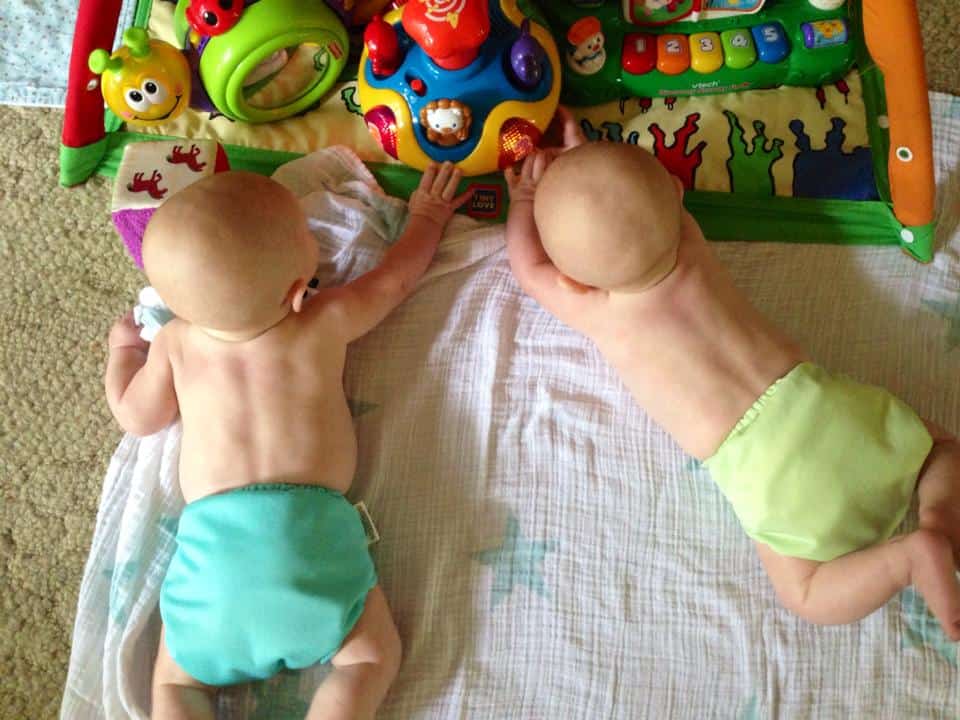 baby twins on a playmat plagiocephaly
