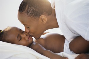 10 Tips for Sleep-Deprived Parents mom kissing baby