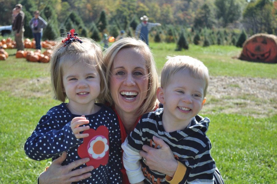 mom holding 3 year old twins third baby after twins