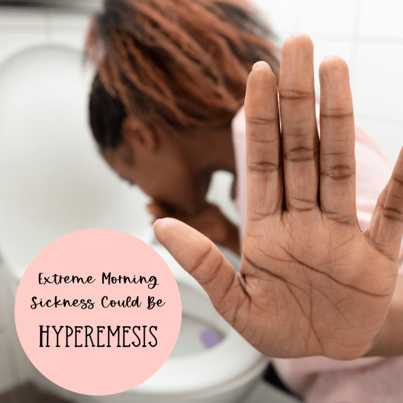 woman vomiting in a toilet and hold her hand up hyperemesis