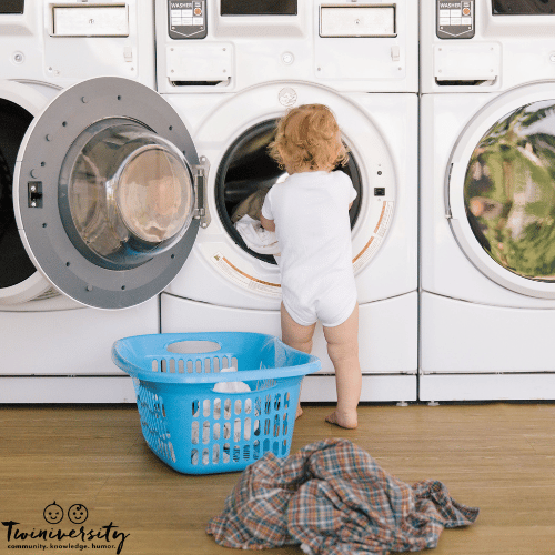 a toddler helps with the laundry