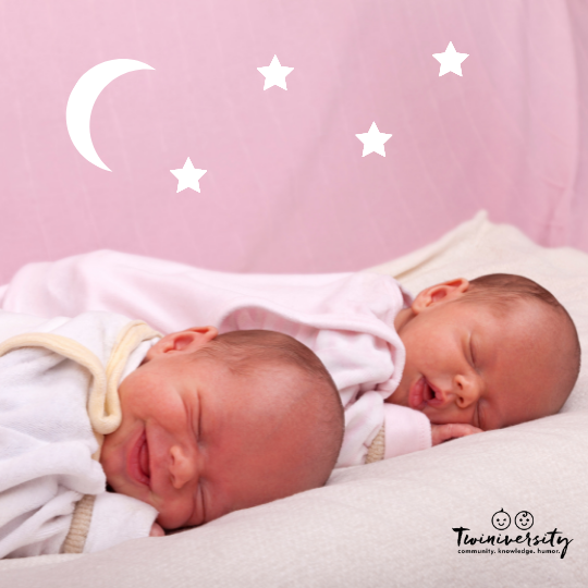 newborn twins sleeping on a white quilt with a pink background and  white moon and stars