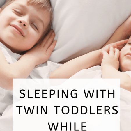 toddler twins sleeping on a bed