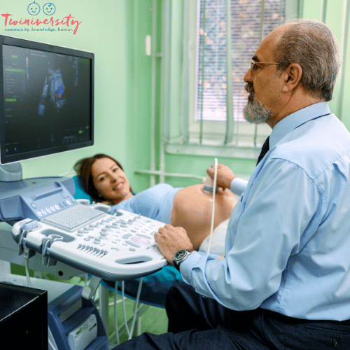 a woman has an exam by a maternal fetal monitoring specialist during a normal twin pregnancy