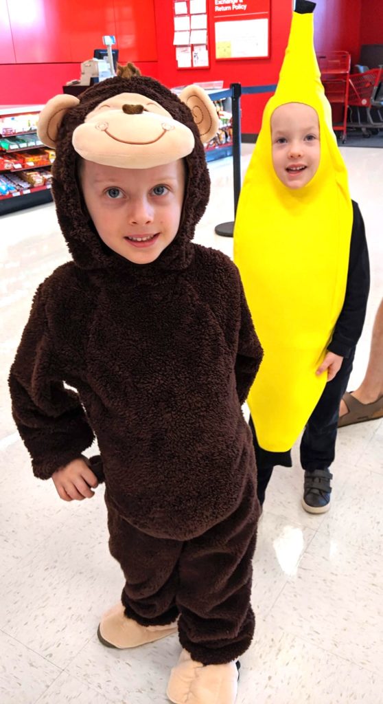 twin boys dressed up like a monkey and a banana