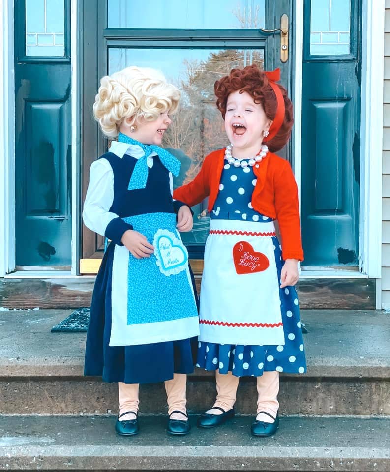 twin girls dressed up like lucy and ethel from i love lucy