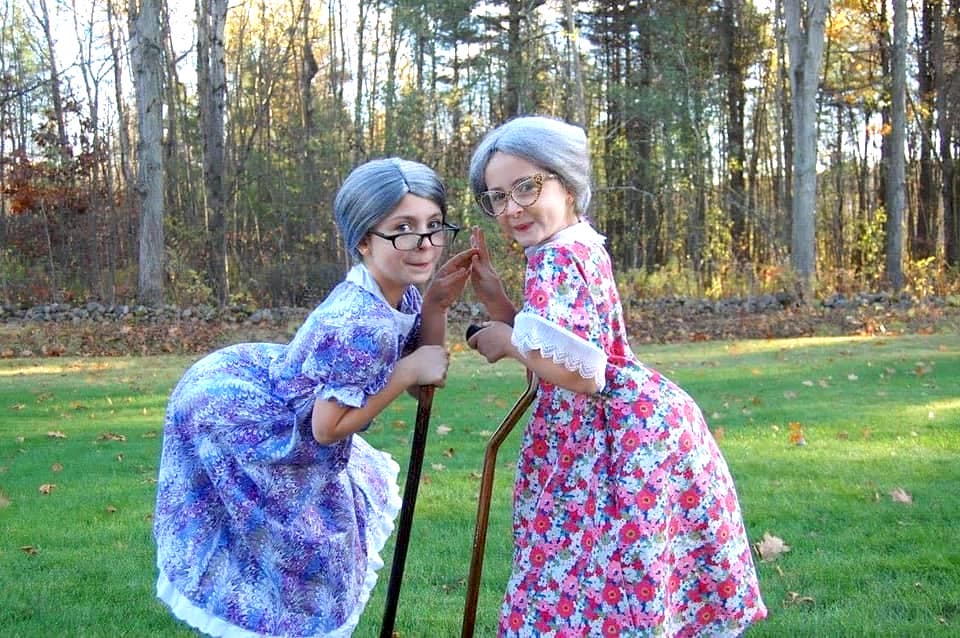 twin girls dressed up like old ladies