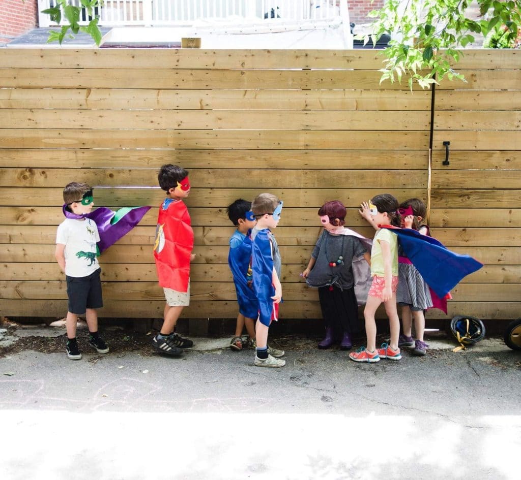 twins' birthday boys dressed up in capes and masks as a superhero costume