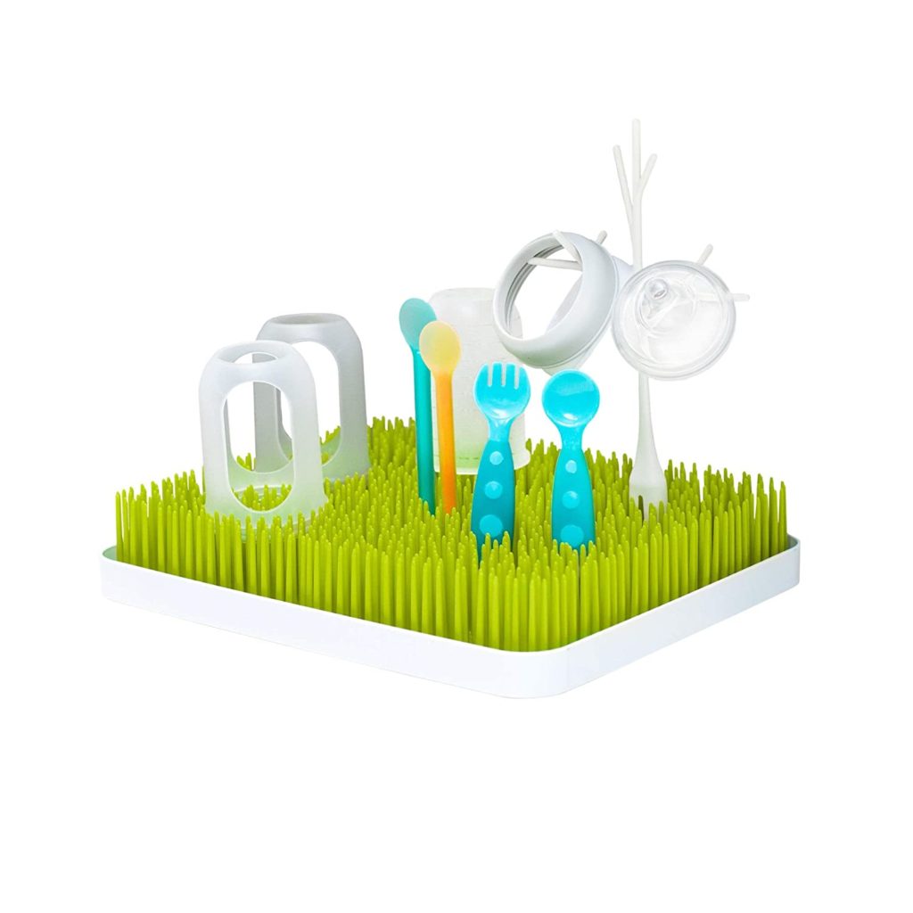 baby bottle drying rack green bottle rack with 2 bottles, nipples, and plastic toddler utensils