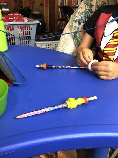 remote learning space hands holding fidget toys