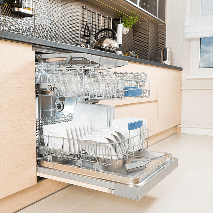 baby bottle drying rack opened dishwasher in a kitchen full of white and glass dishes