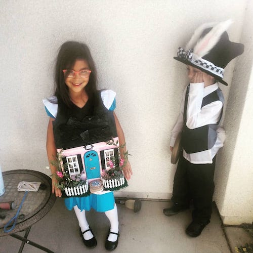 twins dressed as Alice in wonderland characters boy girl twin halloween costumes