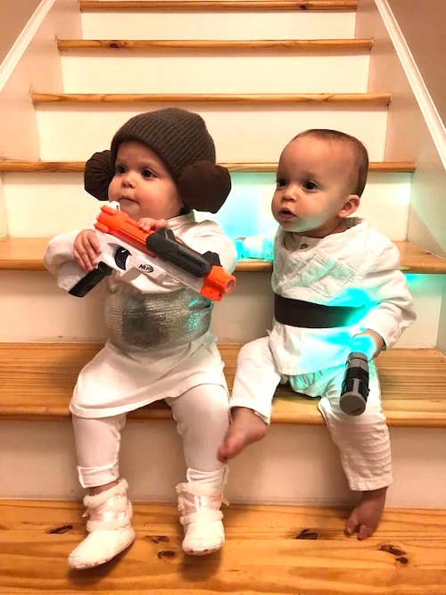 twin toddlers dressed as Luke and Leia boy girl twin halloween costumes