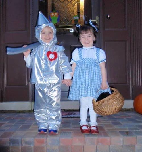 twins dressed as Dorothy and the tin man from the wizard of oz boy girl twin halloween costumes