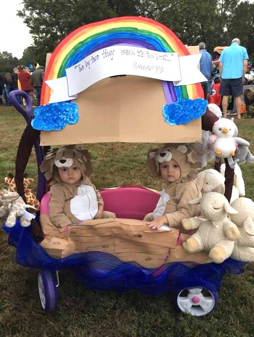 toddler twins dressed as animals in a wagon dressed as Noah's ark boy girl twin halloween costumes