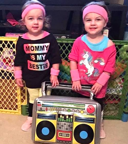 twin girls dressed like 80s workout girls twin girls halloween costumes