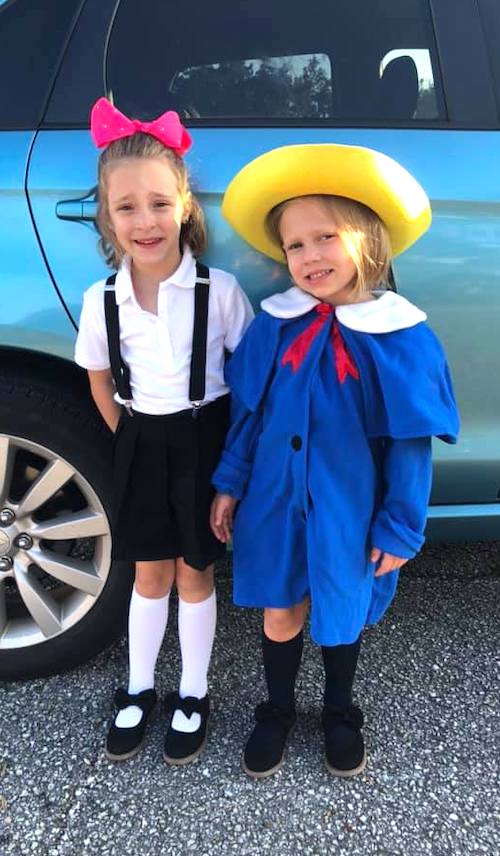 twins dressed up as Eloise and Madeline twin girls halloween costumes