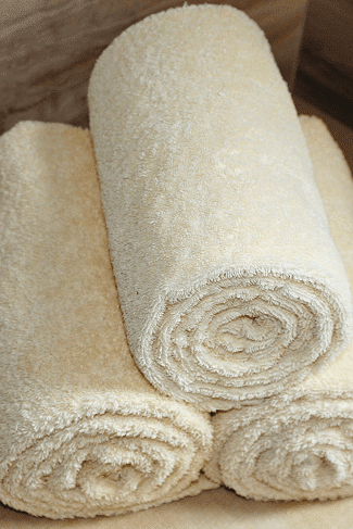 3 rolled up white towels