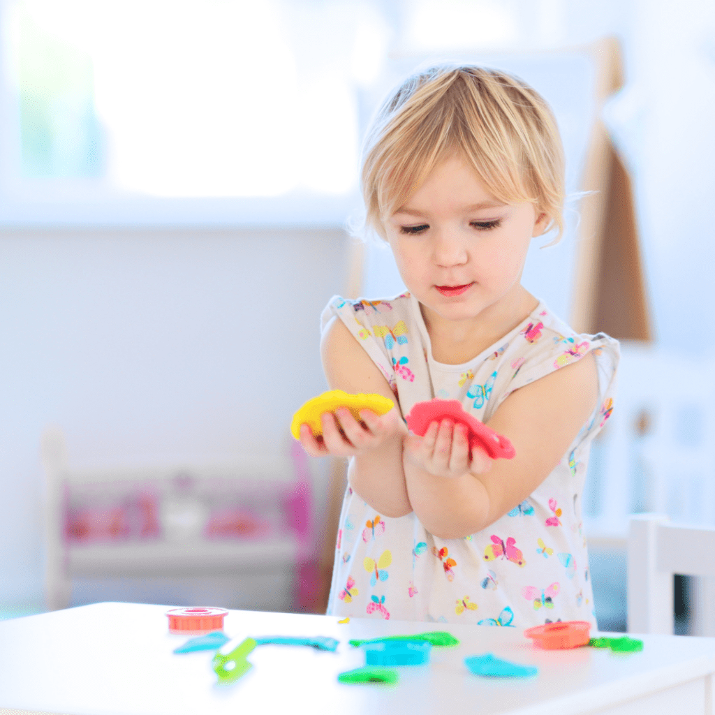 play centers girl with Play-Doh