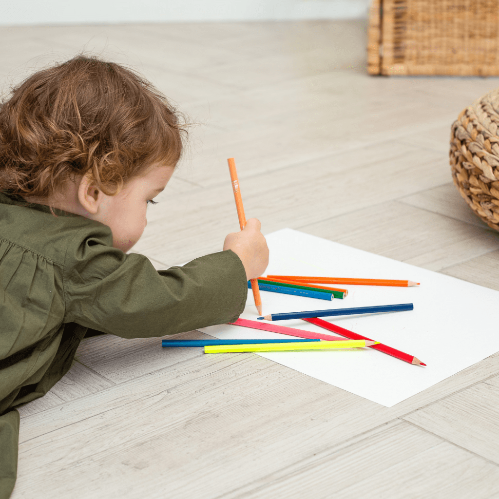 Play centers baby coloring with colored pencils