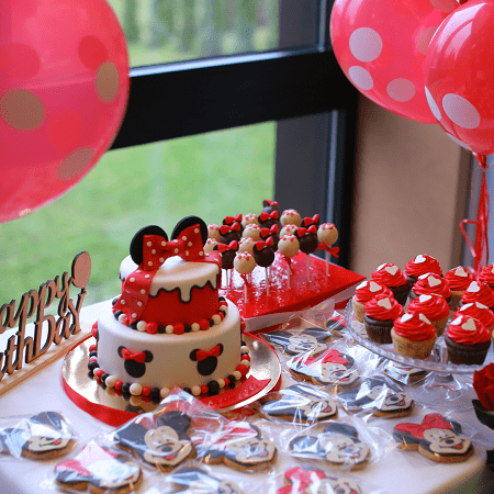 twins' birthday mickey and minnie mouse themed table with cake, cupcake, cookies, cake pops