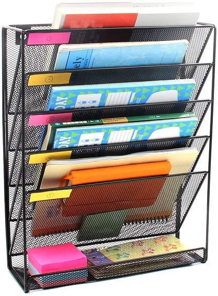 remote learning space hanging wall file holder willed with books and papers