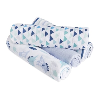 stroller blanket 4 rolled up swaddle blankets stacked on top of each other with different shades of blue and dinosaur prints