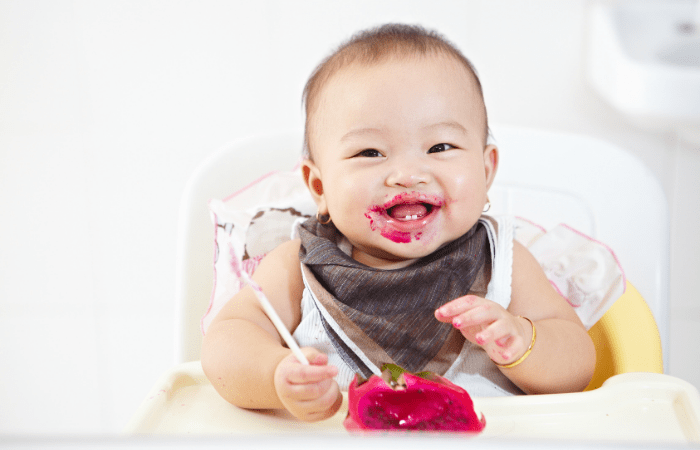 Food Allergies for Babies baby eating in a high chair
