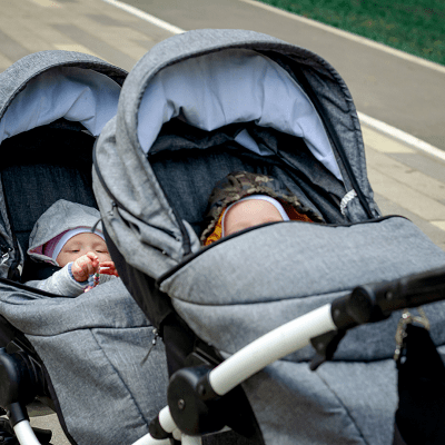 newborn twins stroller newborn twins in a grey tandem stroller