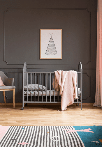 crib mattress dimensions A rug, chair and crib with a mattress in a room with a photo hanging above it on the wall