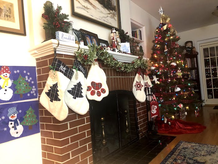 holiday safety tips fireplace mantel decorated for Christmas and Hanukkah