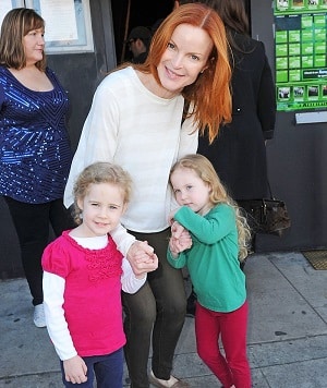 celebrities with twins Actress Marcia Cross holding hand with her twin daughters