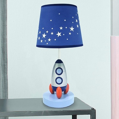 space themed nursery a rocket shaped lamp