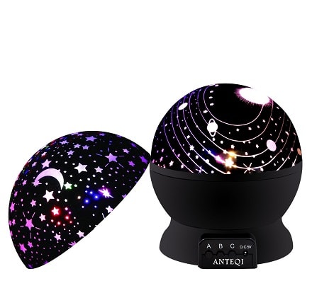 space themed nursery a circular light projector with stars and planets
