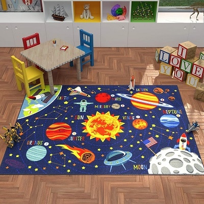 space themed nursery a labeled solar system rug with a rocket and moon 