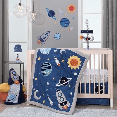space themed nursery a whole nursery set with a crib, sheets, mobile, lamp and blankets