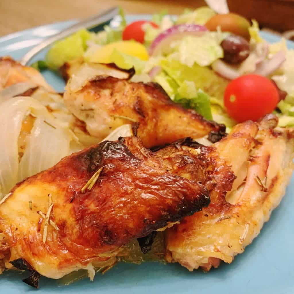 bucket list chicken wings plated with salad