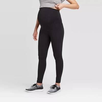 maternity leggings. a pregnant woman wearing black leggings