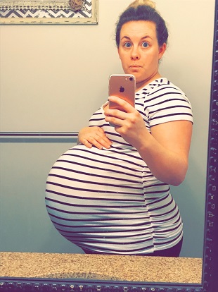 post twins body a pregnant woman taking a selfie in a mirror