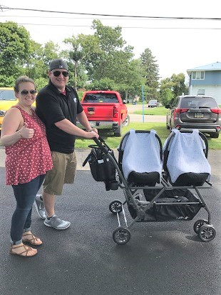 post twins body a couple walking with a twin stroller