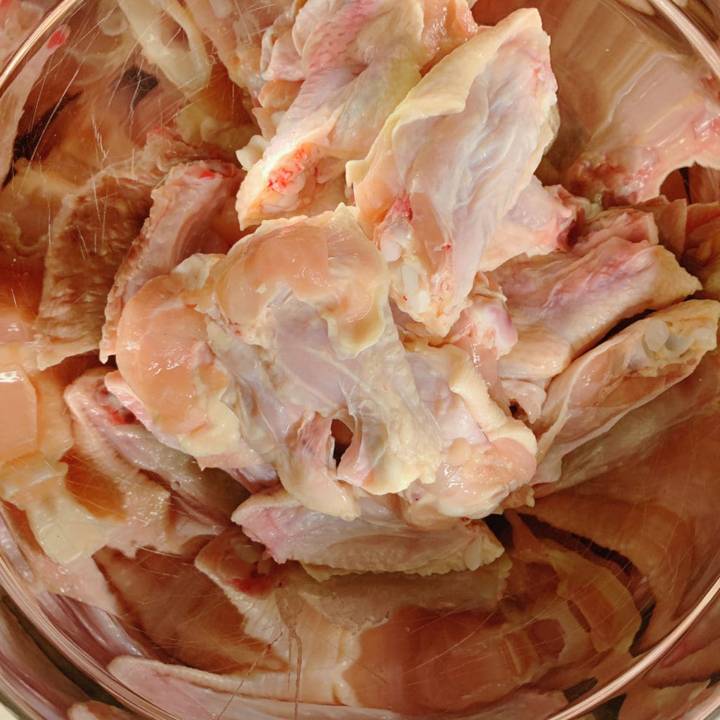 raw chicken wings in a bowl