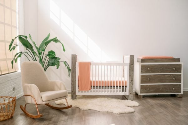 baby's room with crib, dresser, and rocker