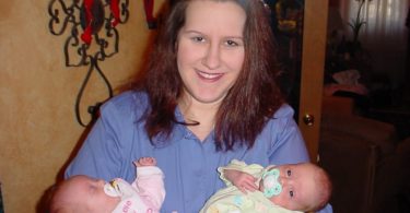 mom holding newborn twins