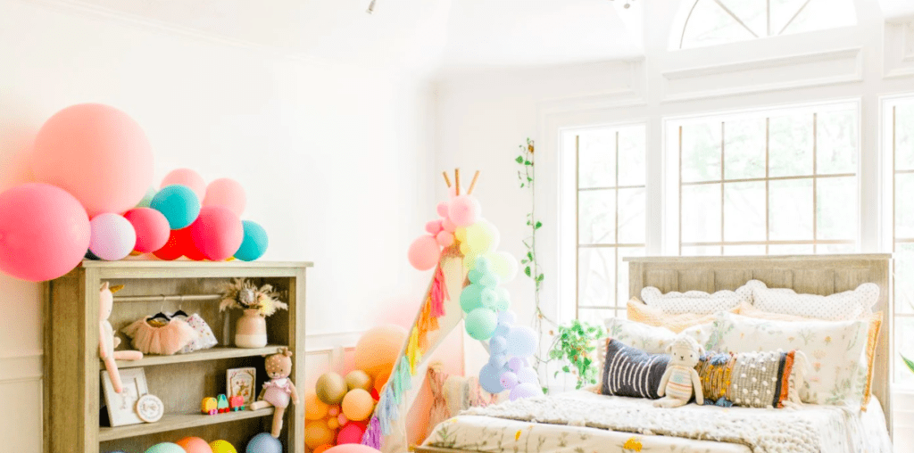 girls bedroom with bed and bookshelf