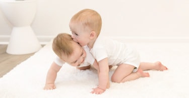 twin baby boys on the floor