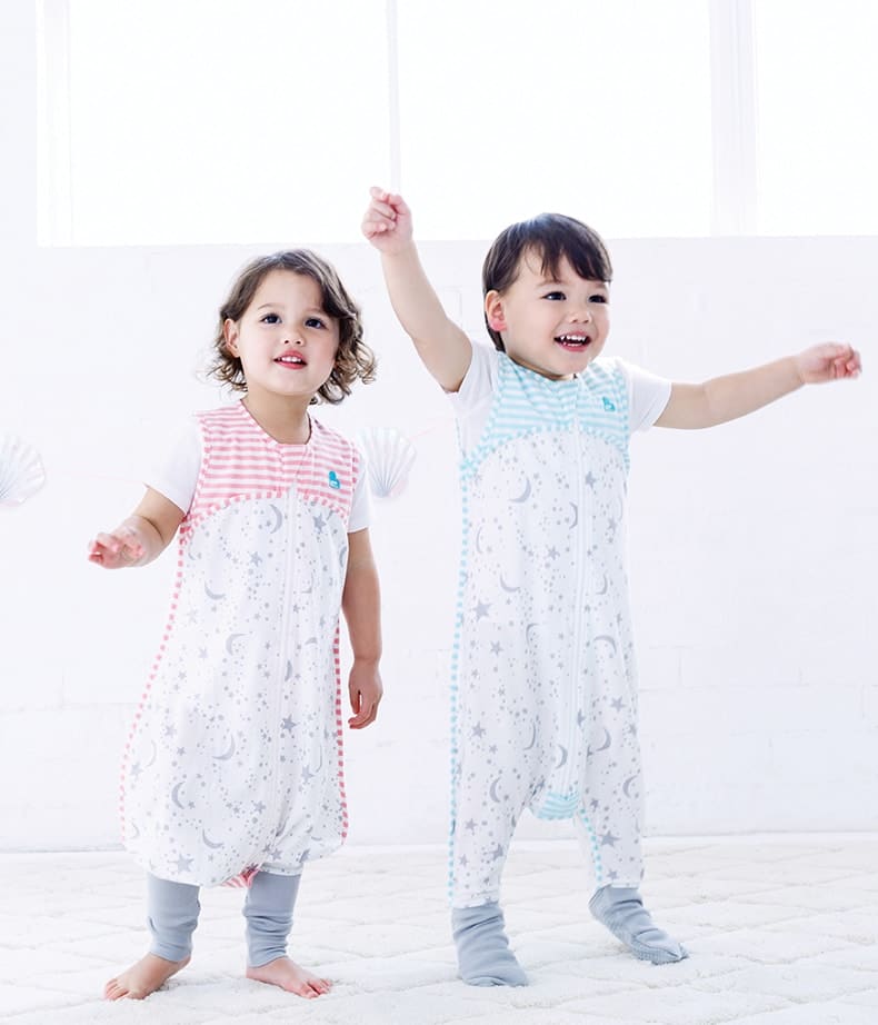 two children wearing sleep suits