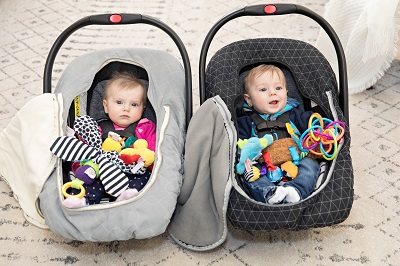 boy girl twins in car seats