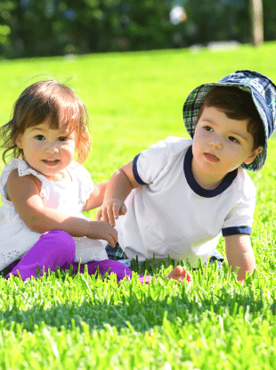 boy girl twins in the grass
