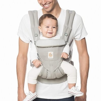 a man using a front baby carrier